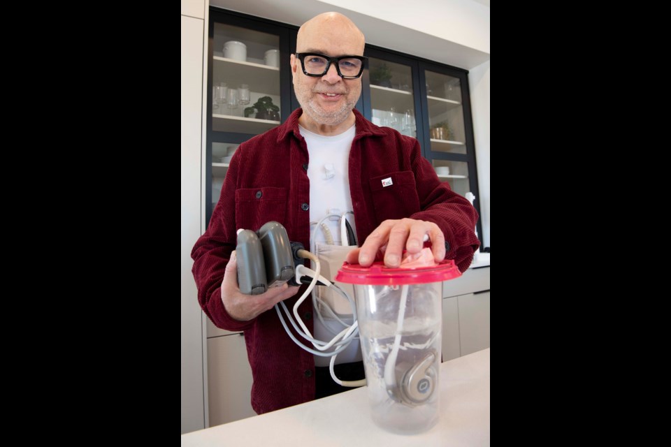 DRINK MIXER? — Former St. Albert resident and retired chef Brad Smoliak demonstrates the operation of a Left Ventricular Assist Device (LVAR) similar to the one in his chest at the launch of the 2024 Full House Lottery in St. Albert. Smoliak said funds from the lottery support the doctors that installed this life-saving device in him five years ago. KEVIN MA/St. Albert Gazette