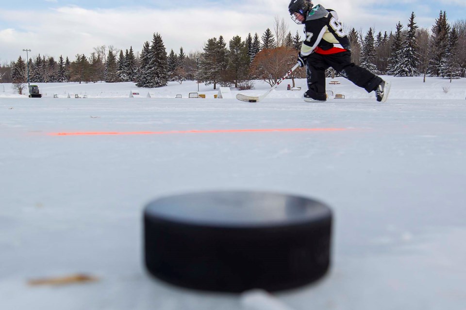 0212 HockeyCovid pond hockey CC thum