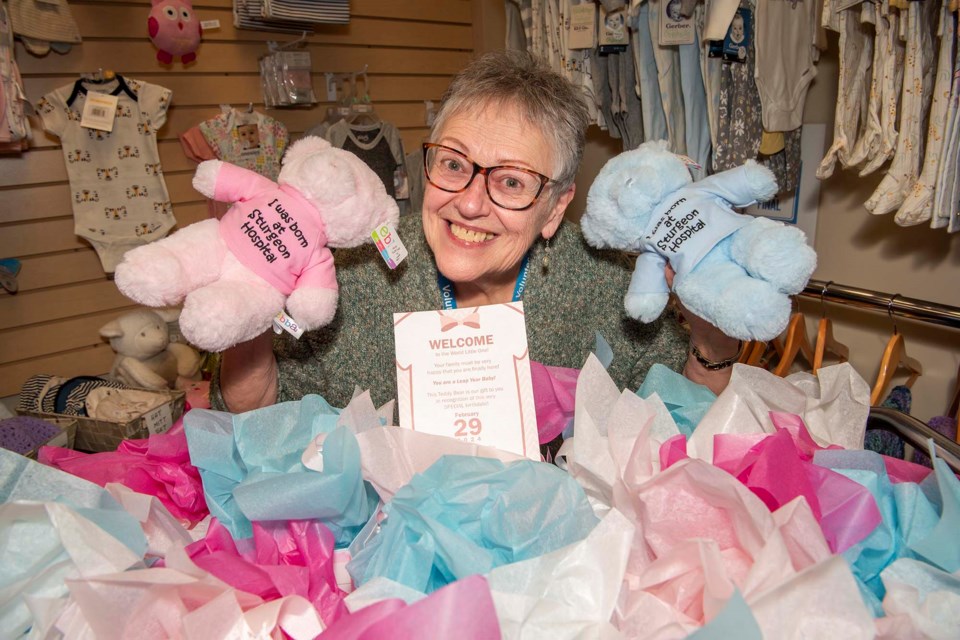 BABY BONUS — SHAVA president Jocelyn Durocher shows off some of the gift bags volunteers have prepared for babies born this Feb. 29, 2024, at the Sturgeon Community Hospital. The bags contain a commemorative certificate and a pink or blue bear. KEVIN MA/St. Albert Gazette