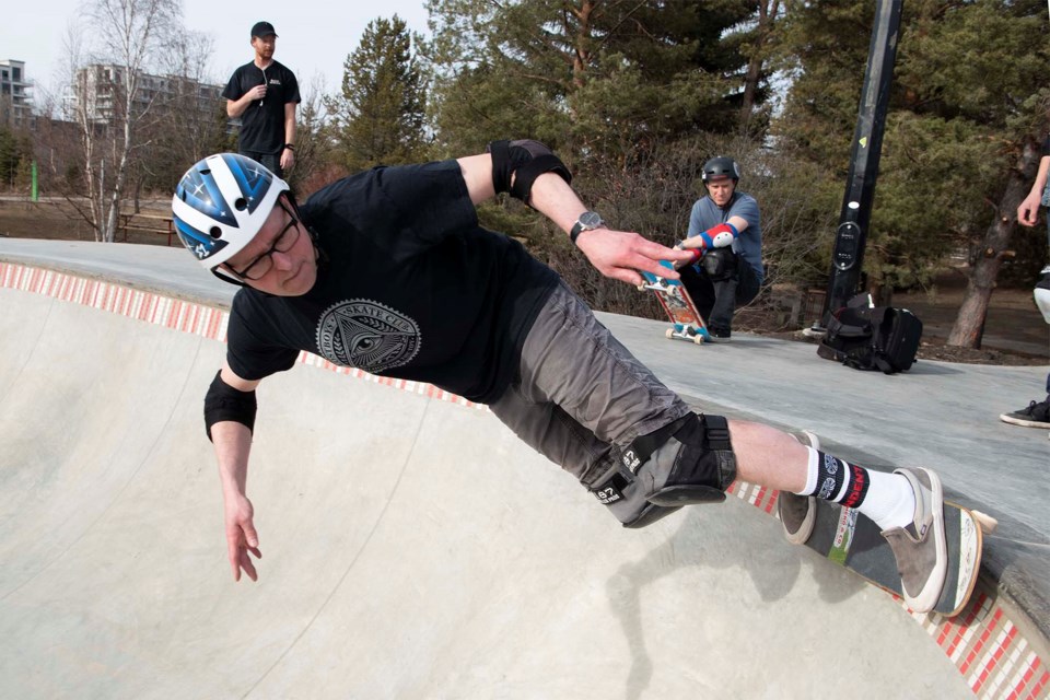 GRINDIN' — St. Albert resident Greg Groves performs a grind along the edge of the pool bowl at the renovated Woodlands Skatepark March 31, 2021. Groves said he was impressed by the rumbling noise the tiles on the lip of the bowl produced when rolled over. KEVIN MA/St. Albert Gazette