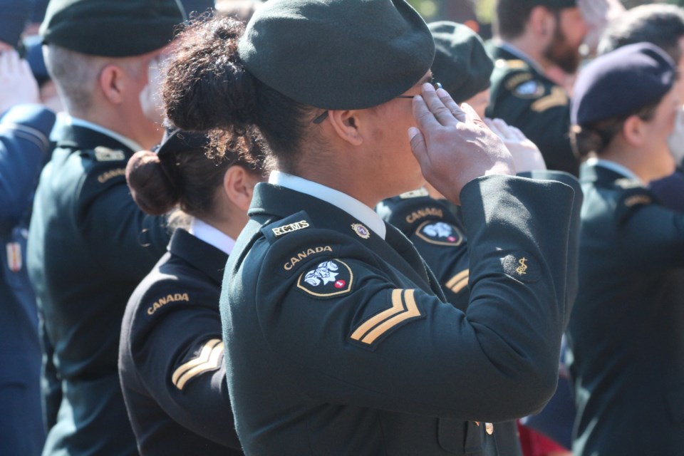 Members of the 1 Field Ambulance unit salute during the playing of God Save the King on Sunday at St. Albert Place. JACK FARRELL/St. Albert Gazette