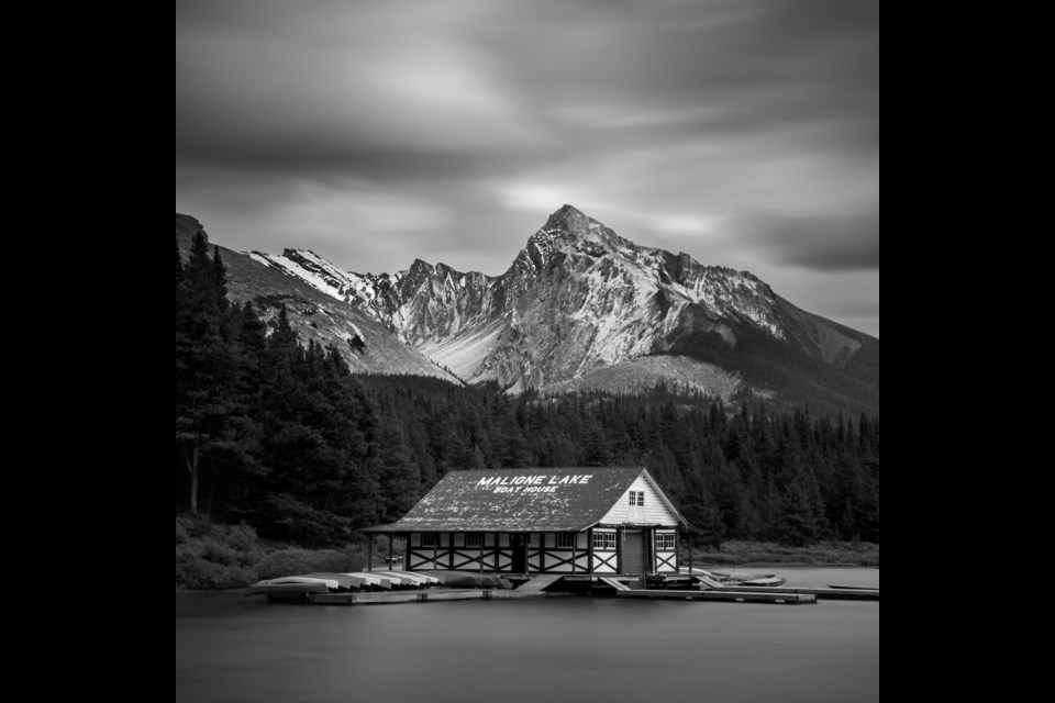 St. Albert photographer Jason Marino captures the Maligne Lake boathouse as darkening clouds warn of storm.