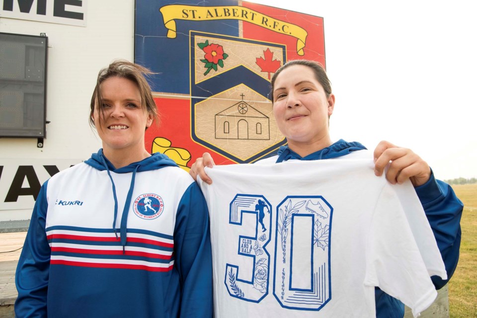 30TH IN STYLE — St. Albert Rugby Football Club members Brandy Hanson (left) and Kendra Fiddler show off some of the commemorative shirts that have been printed to celebrate the 30th anniversary of women’s rugby at the club. Hundreds will be at the club to celebrate the anniversary on July 27, 2024. Hanson and Fiddler are helping to organize that event. KEVIN MA/St. Albert Gazette