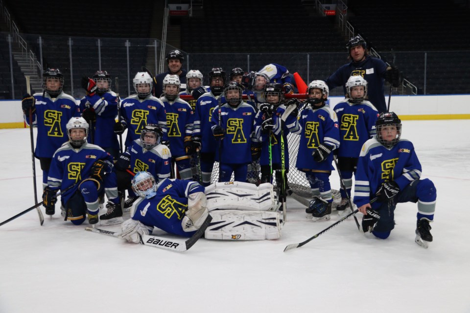 The St. Albert Snipers line up for a photo shoot Saturday, Feb. 4 at Rogers Place arena after being one of four provincial winners of the Ford Oilers Drills & Skills Competition. MATTHEW HAASE