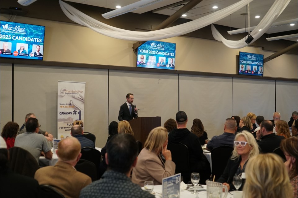 Incumbent Conservative MP Michael Cooper talks about his party's platform to an audience at the St. Albert Curling Club. 