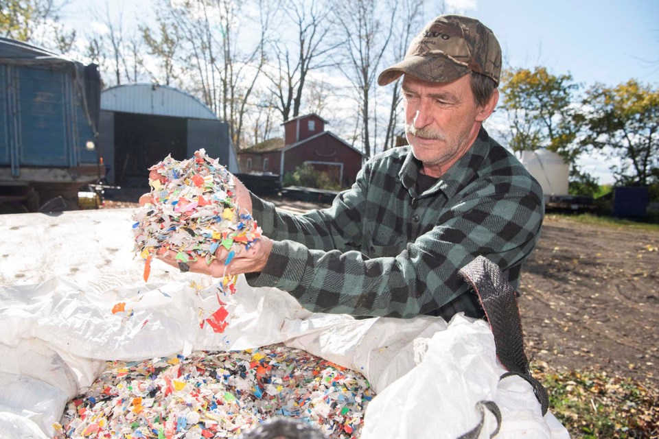 REAL GARBAGE — Tony Schoorlemmer of Alberta Recycled Plastic Lumber examines some of the mixed plastic waste he gets from the Westlock regional landfill. His company turns this low-value waste into plastic lumber. KEVIN MA/St. Albert Gazette