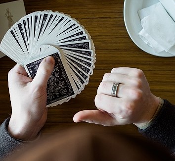 Byron Martin showcases Cards on the Table, a new work filled with magic card tricks at the 2025 Edmonton International Fringe Theatre Festival.