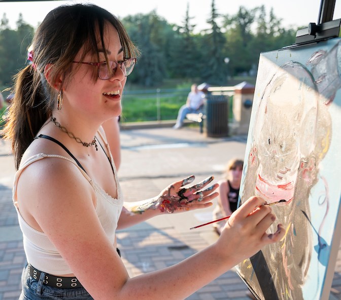 Danielle Too competes in Illuminate's Art Battle. The 2025 Illuminate festival is on Saturday, July 5 at St. Albert Place by the Sturgeon River. 