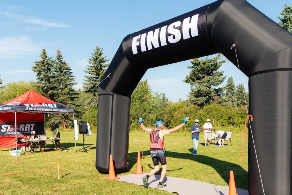 A triathlon athlete finishes the race. BEEDIAMONDPHOTOGRAPHY/ STARRT. 