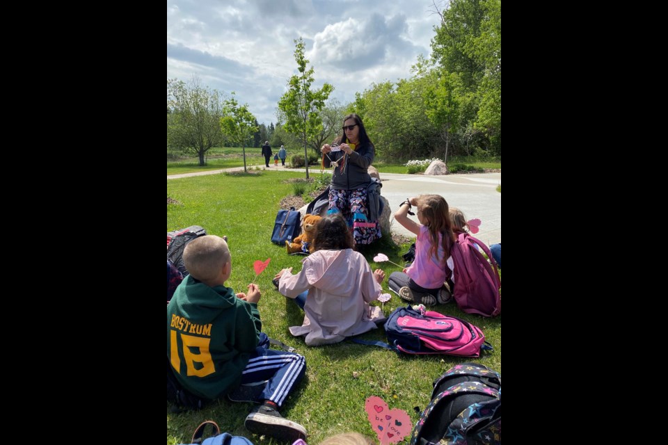 LISTEN — Musée Héritage Museum aboriginal programmer Celina Loyer speaks to Sir Alexander Mackenzie students at the St. Albert Healing Garden in June 2021. Loyer said education about Indigenous history was an essential part of truth and reconciliation. CAM MAKOVICHUK/Photo