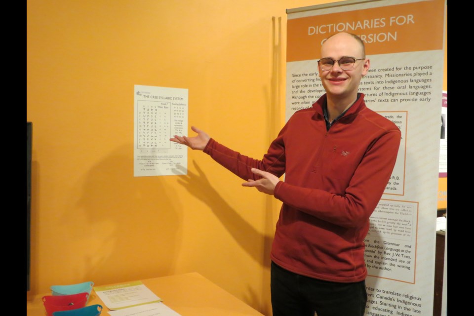 Musée Heritage Museum curator Martin Bierens points to a chart of Indigenous syllabics that is a pillar of an exhibit of First Languages. ANNA BOROWIECKI/St. Albert Gazette