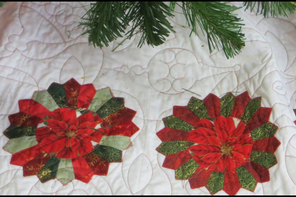 St. Albert Quilters' Guild have constructed a new skirt for the St. Albert Place Christmas tree in a Dresden Flower pattern.                            