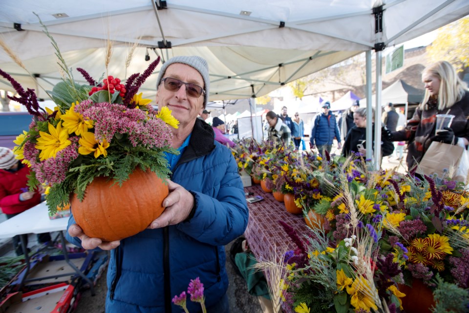 Don holds a pumpkin arrangement at Don's Berry at the St. Albert Farmers' Market.