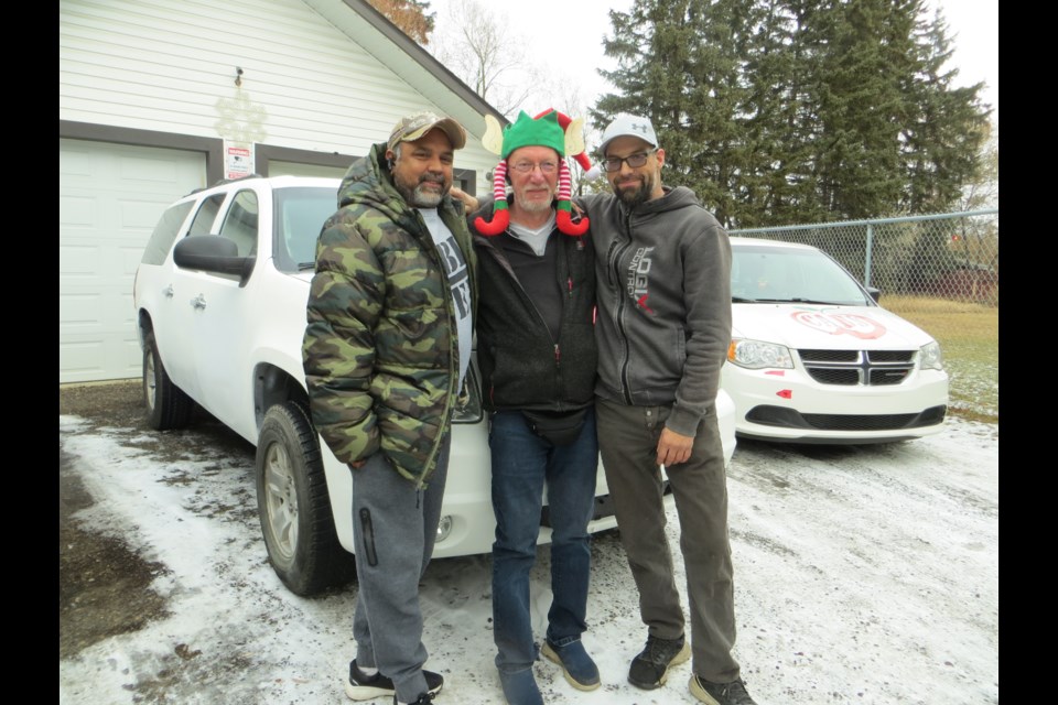 The three amigos,  (left to right) Puneet Gupta;  Sheldon Arnst and Yannick Leveille will be driving Apple Taxis on Christmas Day. ANNA BOROWIECKI/St. Albert Gazette