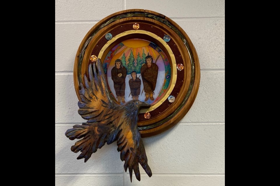 The Gathering is an Indigenous  cedar wood sculpture currently on display at Joseph M. Demko School. 