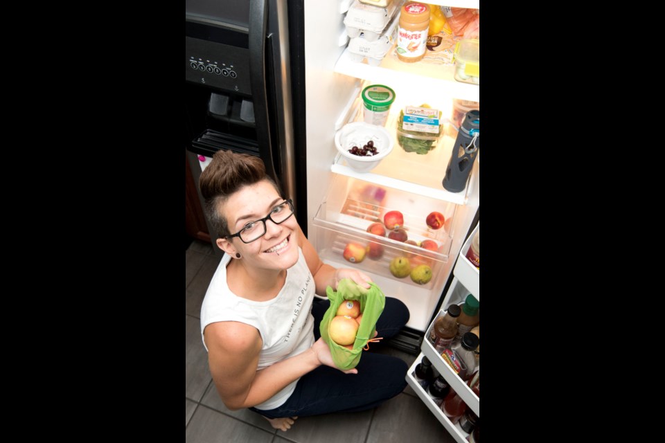 IT STARTS AT HOME — Cass Romyn of Gibbons has taken many steps to reduce plastic waste from her life, such as using reusable produce bags and water bottles and buying in bulk. KEVIN MA/St. Albert Gazette