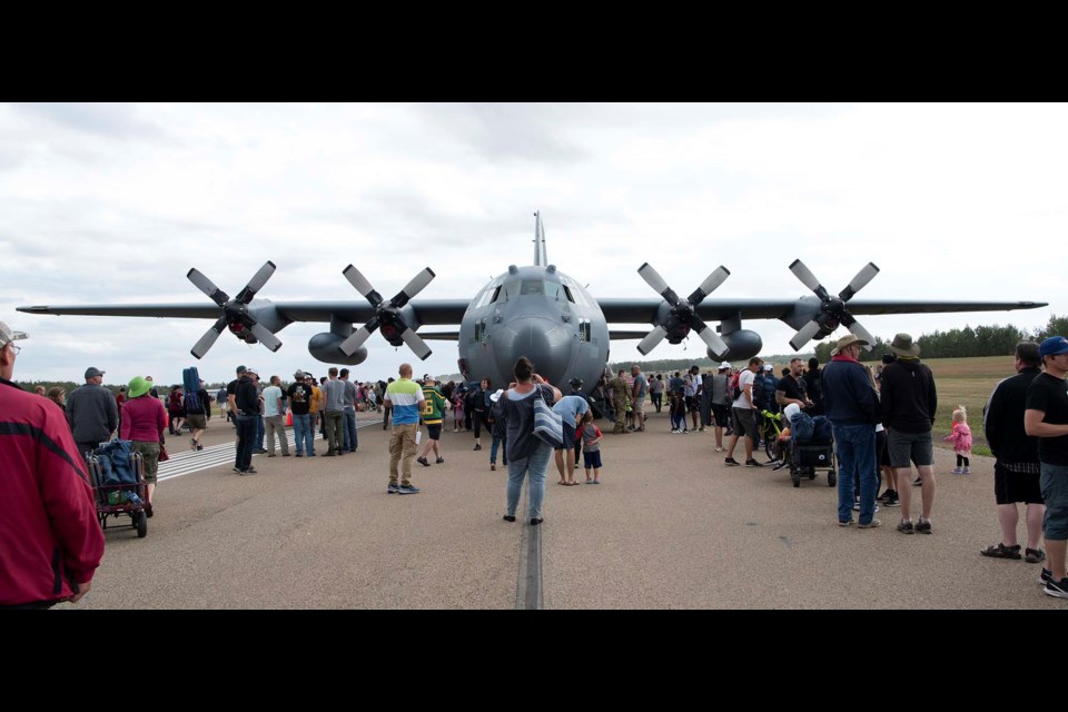 BIG CROWDS, BIG PLANES — Guests at the 2021 Alberta International Airport check out a US C-130 Hercules transport at Villeneuve Airport. Guests lined up to explore the plane's spacious interior. KEVIN MA/St. Albert Gazette
