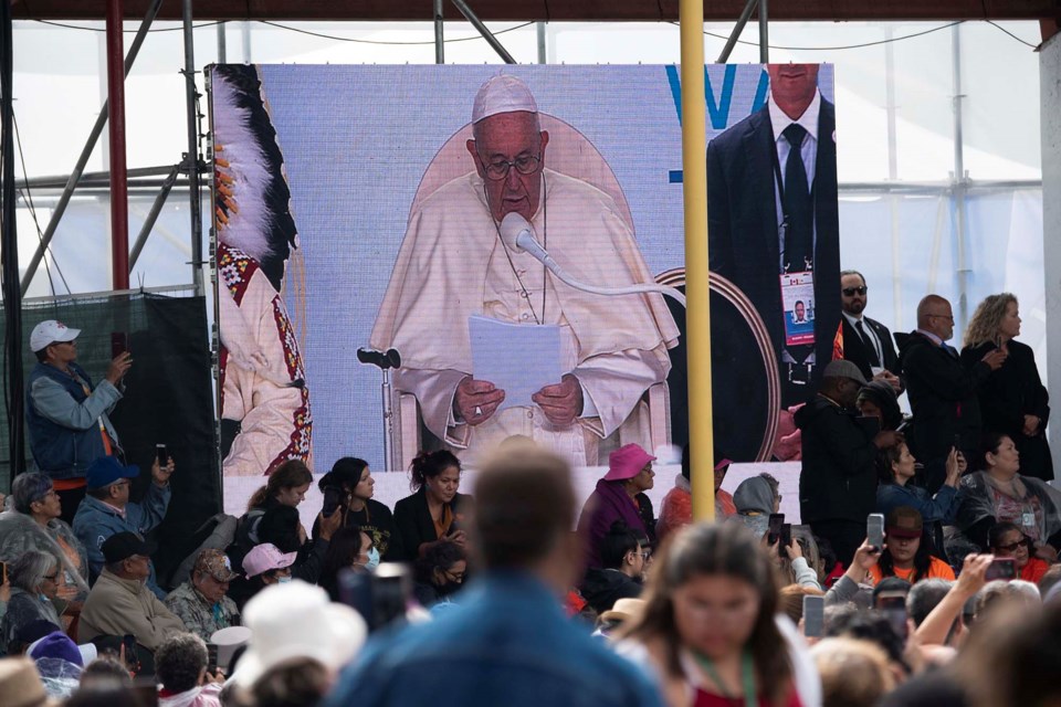 PAPAL APOLOGY — A video screen shows Pope Francis as he reads a speech in Spanish to some 2,000 guests at the Maskwacis powwow arbour July 25, 2022. Francis formally apologized for the Catholic Church's support of Canada's residential school system in his speech. KEVIN MA/St. Albert Gazette