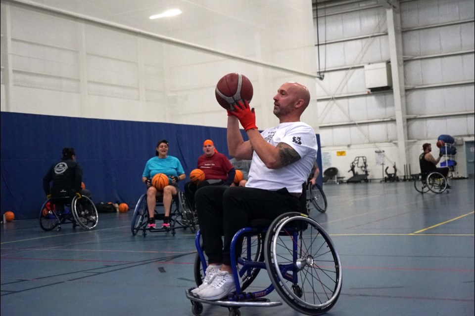 Ryan Vincent, Soldier On's regional coordinator for Alberta and Northern Canada, lines up to take a shot during drills at last week's multisports camp. RILEY TJOSVOLD/St. Albert Gazette