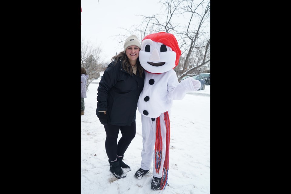 Organizer Shayla McRitchie poses with Bonhomme at the Sturgeon Heights School winter carnival. MARIE-JEANNE SAPORITO/Photo