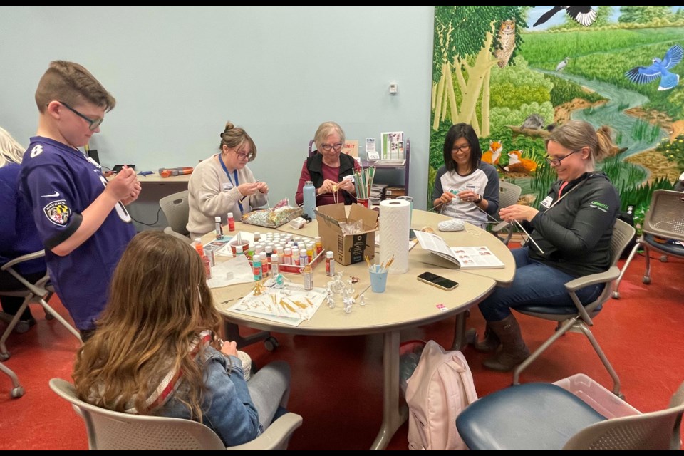 A group of St. Albert  hobbyists from Neutral Ground meet at St. Albert Public Library to knit, paint and play games.