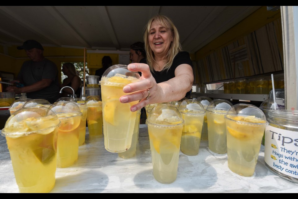 Angie Wiltzen was kept busy making fresh lemonade at the St. Albert Farmers' Market. JOHN LUCAS/St. Albert Gazette