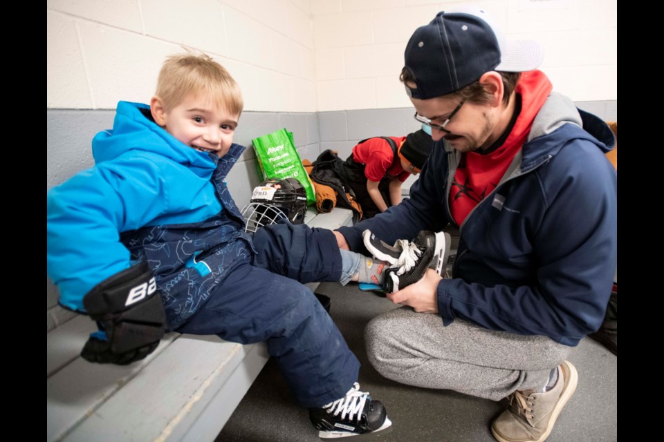 James Howard puts skates on Brooks, 3, at the St. Patrick's Day no-cost skating at Kinex Arena in St. Albert. Additional free skating times are available throughout the week until March 31, 2023: Tuesdays/Thursdays from 6:30 - 7:30 p.m. and Sundays from 1:45 - 3:15 p.m.
BRUCE EDWARDS/ St. Albert Gazette