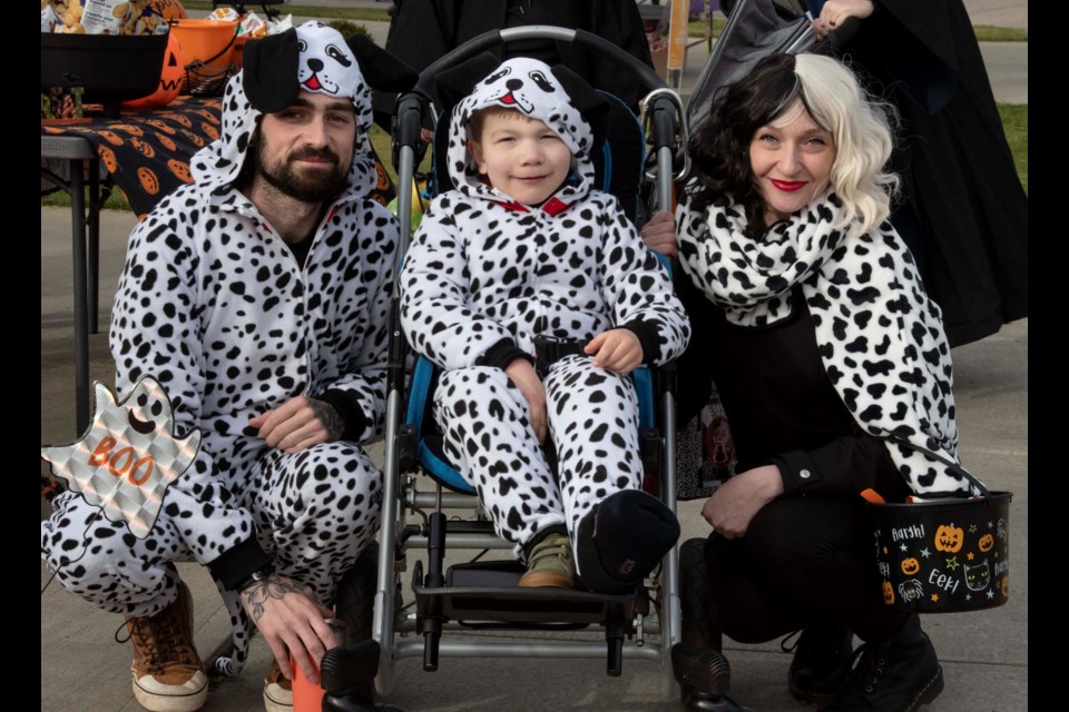 Kevin, Malcolm, 6, and Veronique Hartman are 101 Dalmatians at Treat Accessibly, a Halloween experience  for children of all abilities on Ellington Crescent in St. Albert.