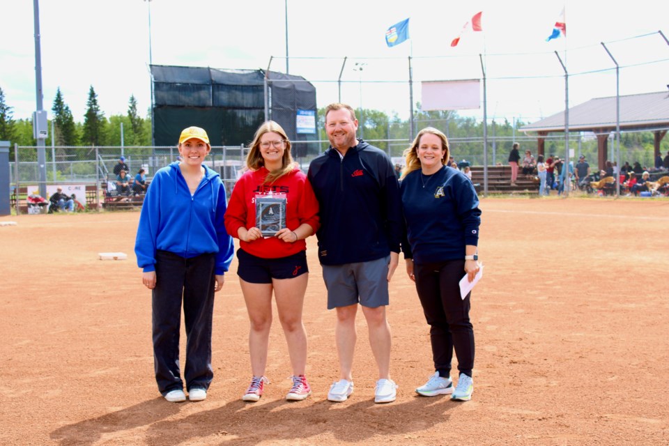 Ella Shoults receiving the Matt Edwards Memorial Heart and Hustle Scholarship. From right to left: Teslyn Edwards, Ella Shoults, Adam Ducarme and Shawna Wasylyshyn. 