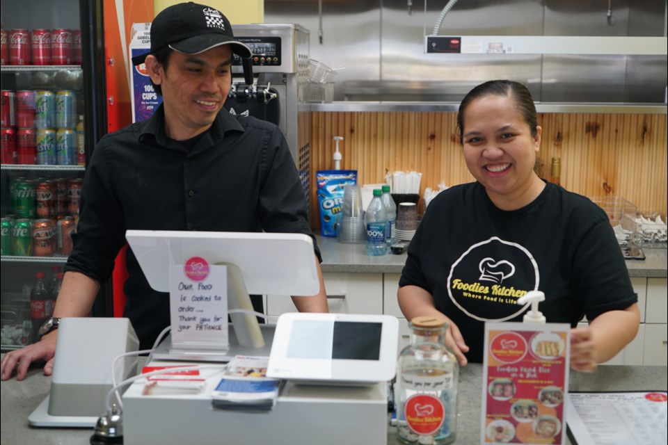 Florence and Rhoneil Palas behind the counter of Foodies, their restaurant at 2008 Tudor Glen in St. Albert. RILEY TJOSVOLD/St. Albert Gazette