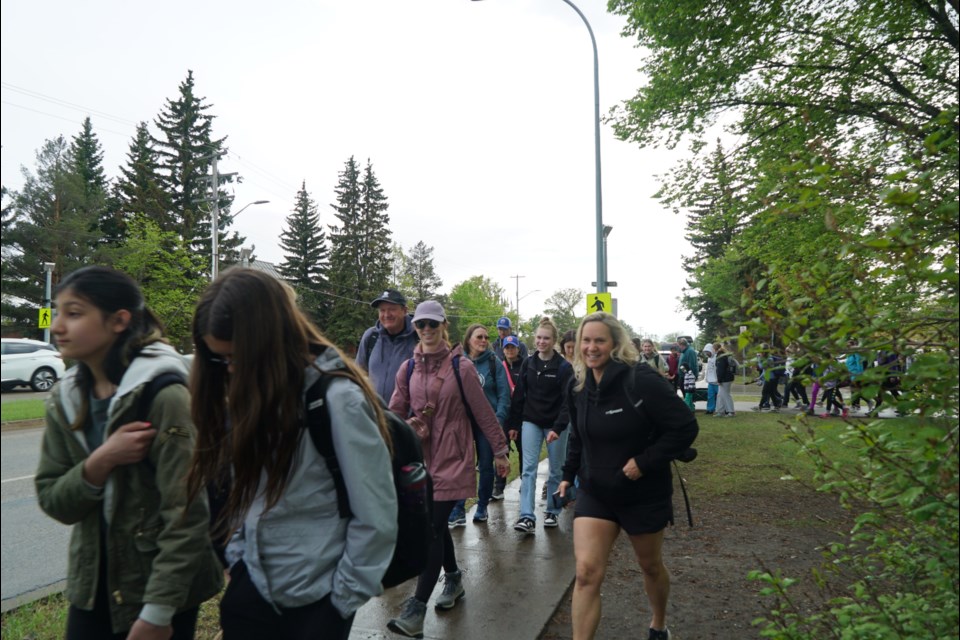 Fit+Fierce members, family and friends walk two kilometres with backpacks full of food to donate to the food bank.                        