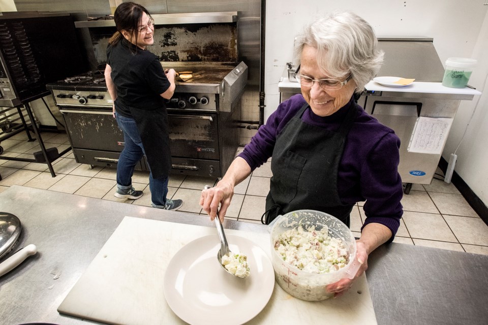 Gidget Bouchard, left, and her mother Lorraine Bouchard prepare a meal at Gidget’s Bistro in St.Albert’s Campbell Business Park on Oct. 29. Gidget's is a vegan or plant-based restaurant that specializes in comfort food – dishes such as mac and cheese, shepherd's pie, fry bread, homemade cookies and bread..  DAN RIEDLHUBER/St. Albert Gazette