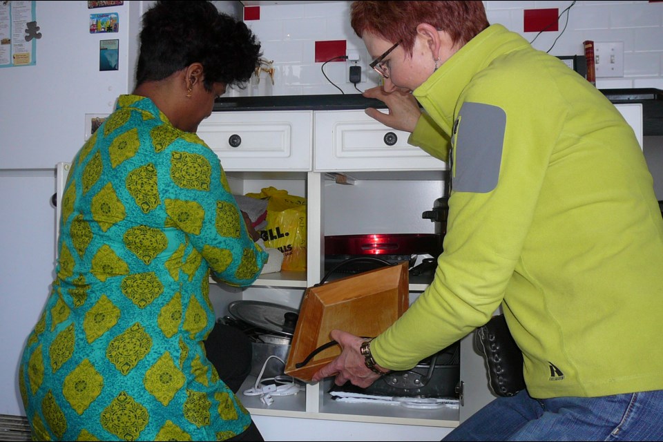 Lynn Fraser, right, works with a client to help declutter her home through her business Balance Your World. Fraser is coming to the library on Thursday to offer a Decluttering and Downsizing workshop/presentation.
LYNN FRASER/Photo