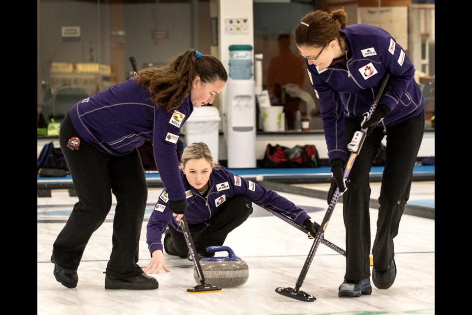 SPIELING – Nyla Kurylowich, right, of Sturgeon County and Susanne Beriault of Winnipeg sweep Holly Jamieson's skip rock during the St. Albert Ladies Bonspiel on Saturday. The Jamieson rink, with Sally Korol of Edmonton as third, alternate Sherry Clark of Winnipeg and coach Taina Smiley are gearing up to represent Canada at the Deaflympics, Dec. 9 to 21 at Madesimo, Italy. Jamieson, a Fort Saskatchewan curler with ties to the St. Albert Curling Club, Kurylowich and Korol curled together on the winning rink at the 2018 Canadian Deaf Games and all three competed at the 2017 World Deaf Curling Championships in Sochi as bronze medallists for Team Canada.
DAN RIEDLHUBER/St. Albert Gazette