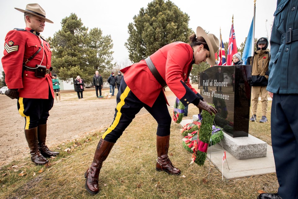 St. Albert RCMP Insp. Pam Robinson, right, and Sgt. Shayne Courtorielle place their wreath at the Field of Honour entrance during the No Stone Left Alone ceremony at St. Albert Municipal Cemetery Nov. 4.
DAN RIEDLHUBER/St. Albert Gazette