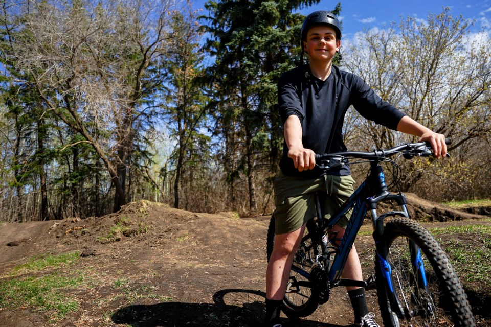 Brennan MacDonald at the St. Albert dirt jumps May 6, which he is bidding the city not to demolish in a petition that has garnered nearly 1,300 signatures. HANNAH LAWSON/ St. Albert Gazette 