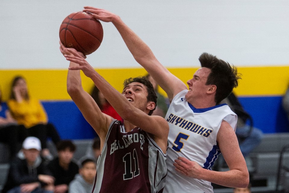 STUFFED – Colin Torak-Both of the St. Albert Skyhawks clamps down defensively against Adam Rafat of the Bellerose Bulldogs on Tuesday in the metro Edmonton division two ability round at the SkyDome. The Skyhawks won 65-62 after leading 34-33 at halftime. The Skyhawks and Bellerose are back in division two and league play starts Monday for both teams in their home gyms at 6:30 p.m.
CHRIS COLBOURNE/St. Albert Gazette