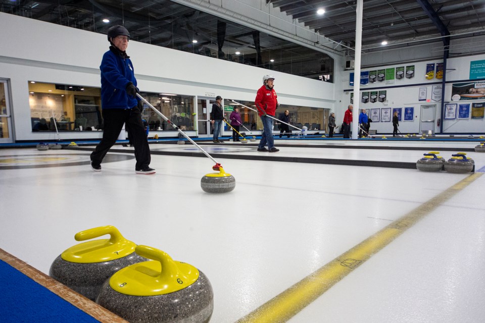 STICKING IT – Mel Yonker, who is 94 years young, delivers a rock in the St. Albert two-person stick league  Tuesday. Next weekend the St. Albert Curling Club hosts the Alberta Stick Curling Championships with 24 two-person teams competing for the provincial trophy sponsored by Milt and June McDougall of St. Albert. The winner will represent Alberta at the April 6 to 9 nationals in Regina. Randy and Ruby Olson of St. Albert are the defending Alberta champions. 
CHRIS COLBOURNE/St. Albert Gazette