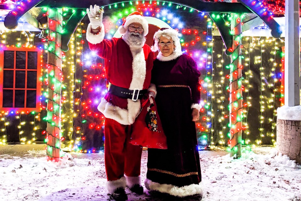 Santa and Mrs. Clause step out of their home to greet visitors at The Winter Wonder Forest. SUPPLIED