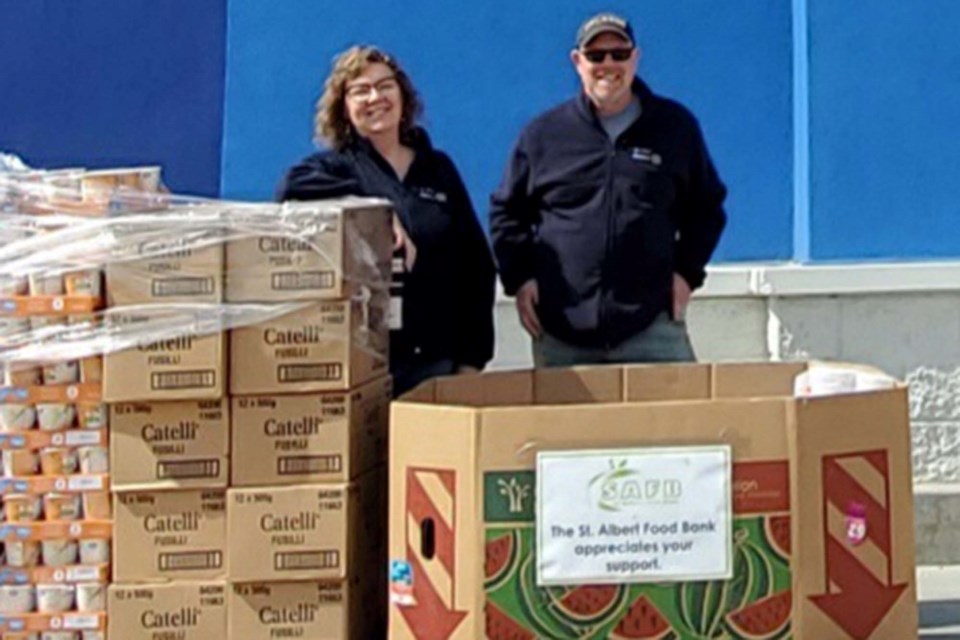 Rotarians Jennifer McCurdy and Craig Malin are pleased with the first donations. The 2022 Spring Food Drive was a resounding success thanks to the collaborative efforts of several local service clubs and grocery stores. SUPPLIED/Photo