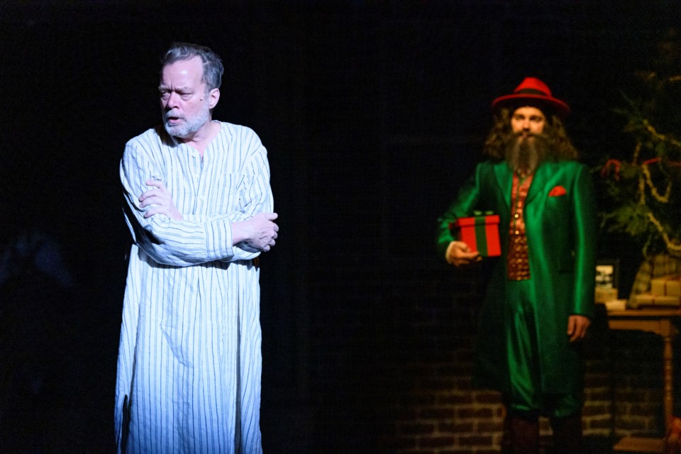 Scrooge (Ted Dykstra) is forced to face his actions as the Ghost of Christmas Present (John Ullyatt) forces him to face his actions in the newly revamped A Christmas Carol now playing at Citadel Theatre. IAN JACKSON/Photo