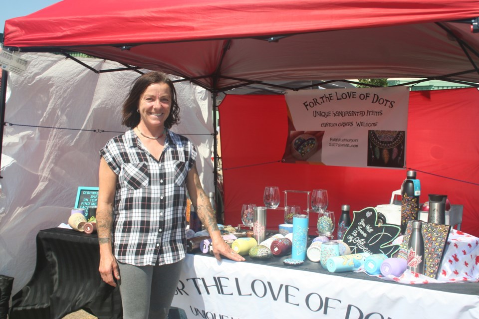 Anja Bock, a St. Albert Farmers' Market vendor, adapts her passion for manadala painting to functional items such as mugs, glasses, thermoses and rocks. ANNA BOROWIECKI/St. Albert Gazette