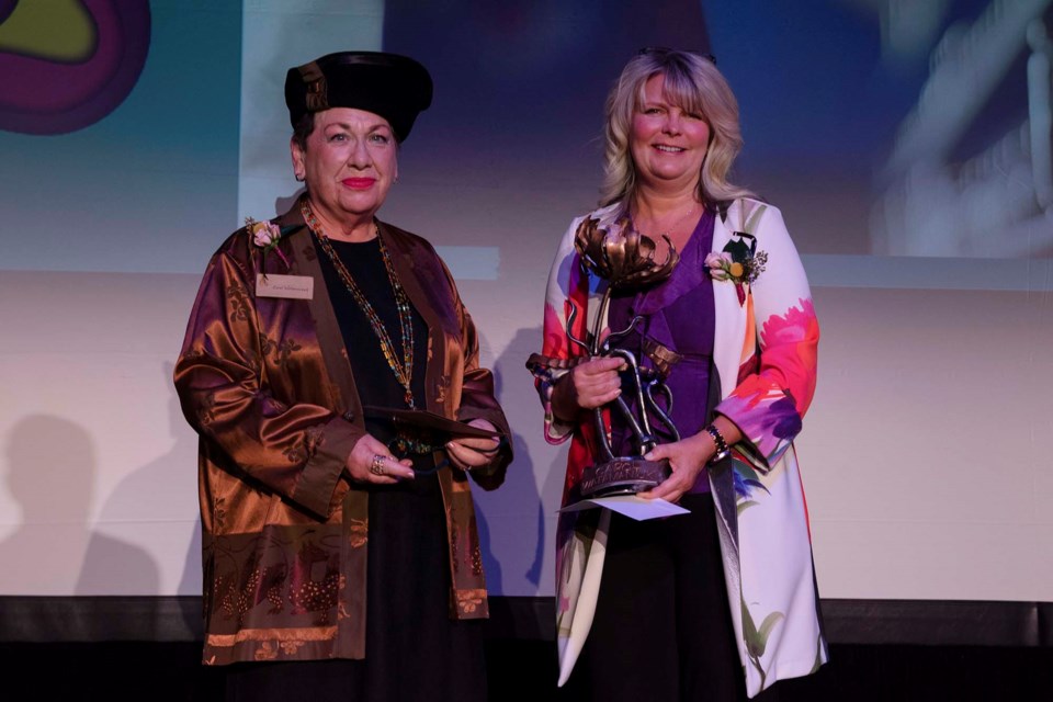 Mayor Cathy Heron presents Carol Watamaniuk with a Lifetime Achievement Award for her uncompromising service to the arts community. The presentation was part of the 11th Annual Mayor's Celebration of the Arts on April 7, 2022. GLEN FREEMAN/Photo