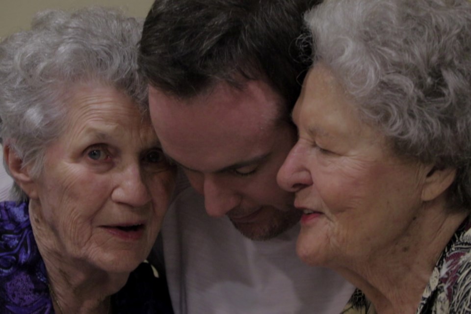 Chris Bolan shares a hug with Aunt Pat and his biological great-aunt Terry. Terry Donahue was a member of the All-American Girls Professional Baseball League, which was made famous in the movie A League of Their Own. NETFLIX/Photo