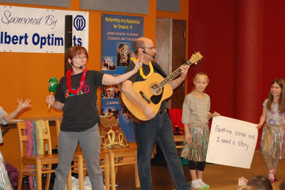 Maureen Rooney and Paul Punyi encourage their young audience to participate in the Rooney and Punyi Reading Show. 