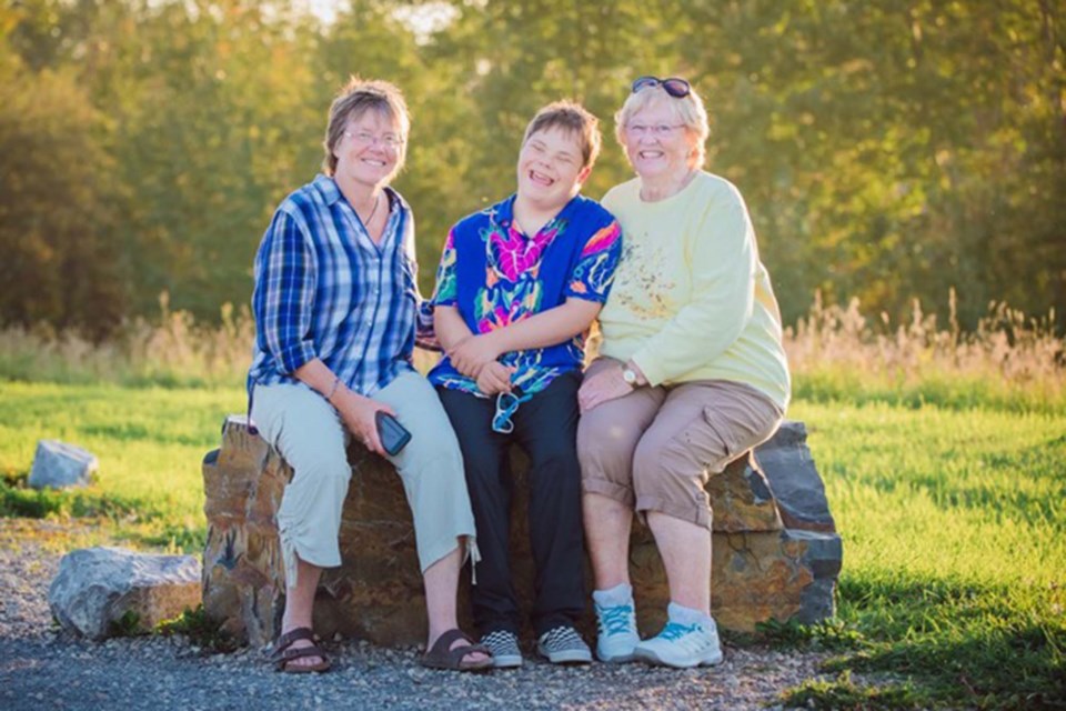 Through the SAIL Foundation, Carol Vogler (left) and Alice Sears have started a group home for four young adults with disabilities including Alice's grandson, Erik (centre). TIM OSBORNE/Photo