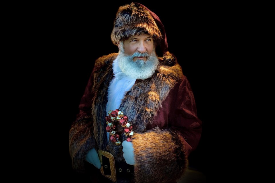 Santa Claus is looking dapper in his new suit. He, along with helper elf Missy Claus, will make an early appearance on the pedestrian bridge on Nov. 14 from 10 to 3, bringing good cheer and collecting donations for Hope Mission at the same time.