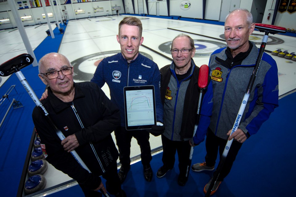 SWEEPING UP – St. Albert Curling Club lifetime members, from left, Ray (Rules) Rouault, Neil (Arm Strong) McKay and Don (The Builder) Johnston donated three SmartBrooms to the St. Albert Junior Elite Development (STAJED) program and two-time Olympian Marc Kennedy assisted in Thursday's introductory session with the sweeping devices. The SmartBrooms connect to a smartphone or tablet via bluetooth and track the sweeper's movements and power. The SmartBrooms cost $1,000 each and the sticks have a donor's name inscribed on them. They will be accessible to STAJED and club members. 
CHRIS COLBOURNE/St. Albert Gazette