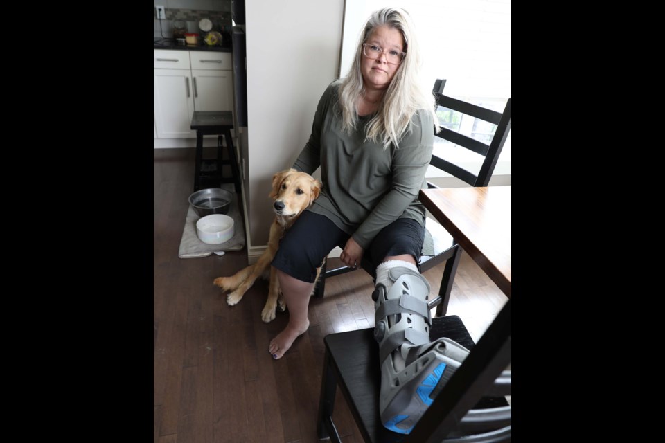 On May 25 Kristen Bodnarchuk broke her ankle in two places when she was bowled over by loose dogs at the Lacombe Lake Park off-leash area.