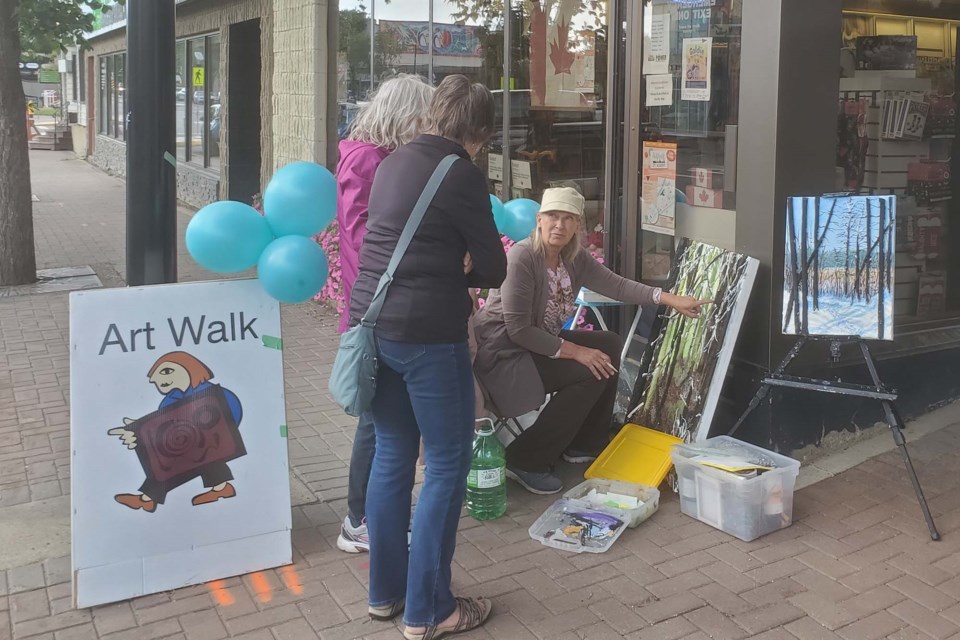 Upcycle visual artist Elaine Mulder takes time to chat with passers-by during the St. Albert Art Walk on Thursday, Aug 4, 2022. ANDREW RACZYNSKI/Photo